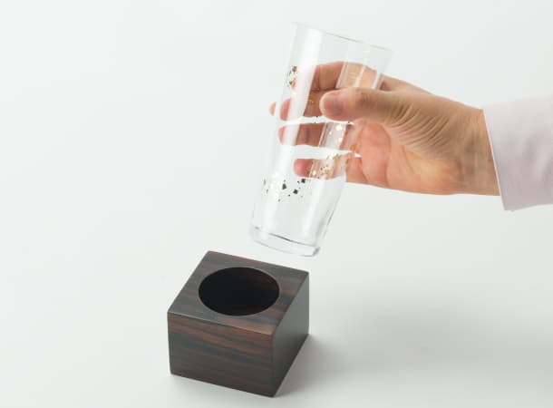 Soka Gakkai glass flower stand ebony base